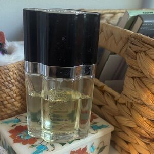 1/2 of 1.7 ounces Oscar de Laurent perfume.